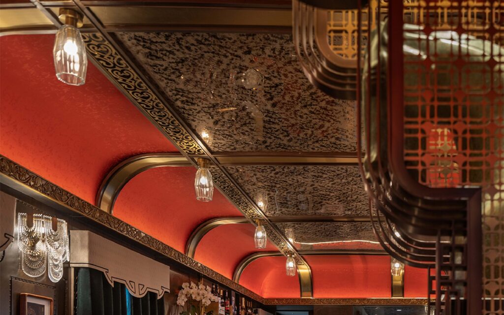 The Star Palace lounge car of the Silk Road Express, with its red lacquer ceiling and bar