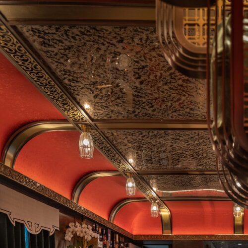 The Star Palace lounge car of the Silk Road Express, with its red lacquer ceiling and bar