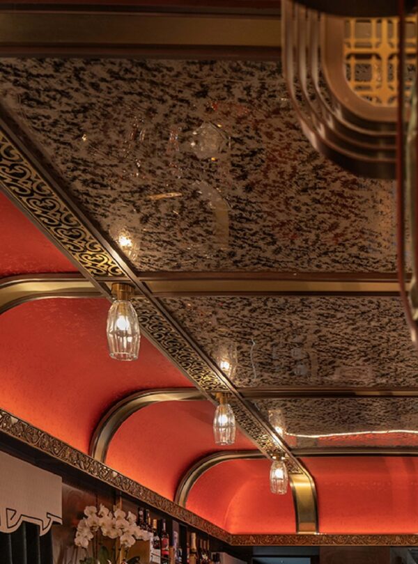 The Star Palace lounge car of the Silk Road Express, with its red lacquer ceiling and bar