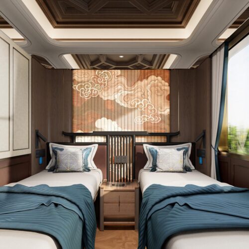 Twin beds in the Han-style cabin 汉风主题客房双床 · China Express Travel Golden Panda Express
